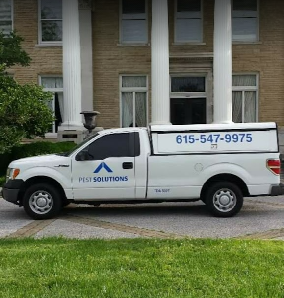 Pest Solutions truck at a residential home for pest control